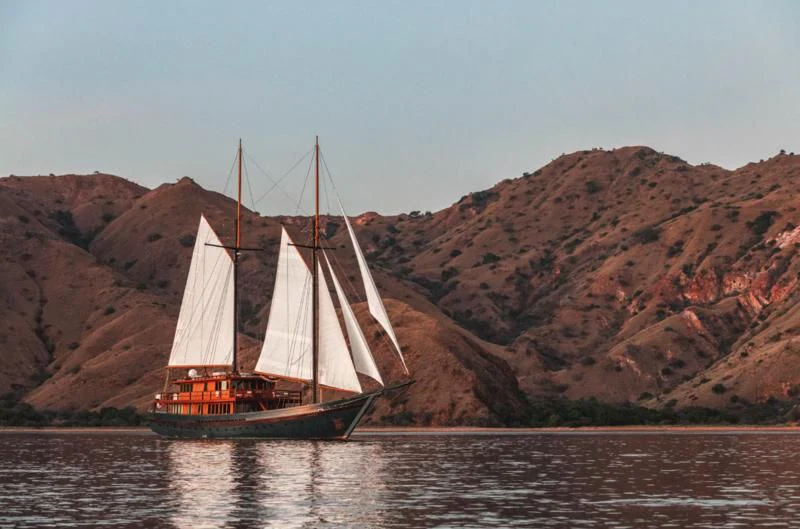 a sailboat on the water aboard VELA Yacht for Charter