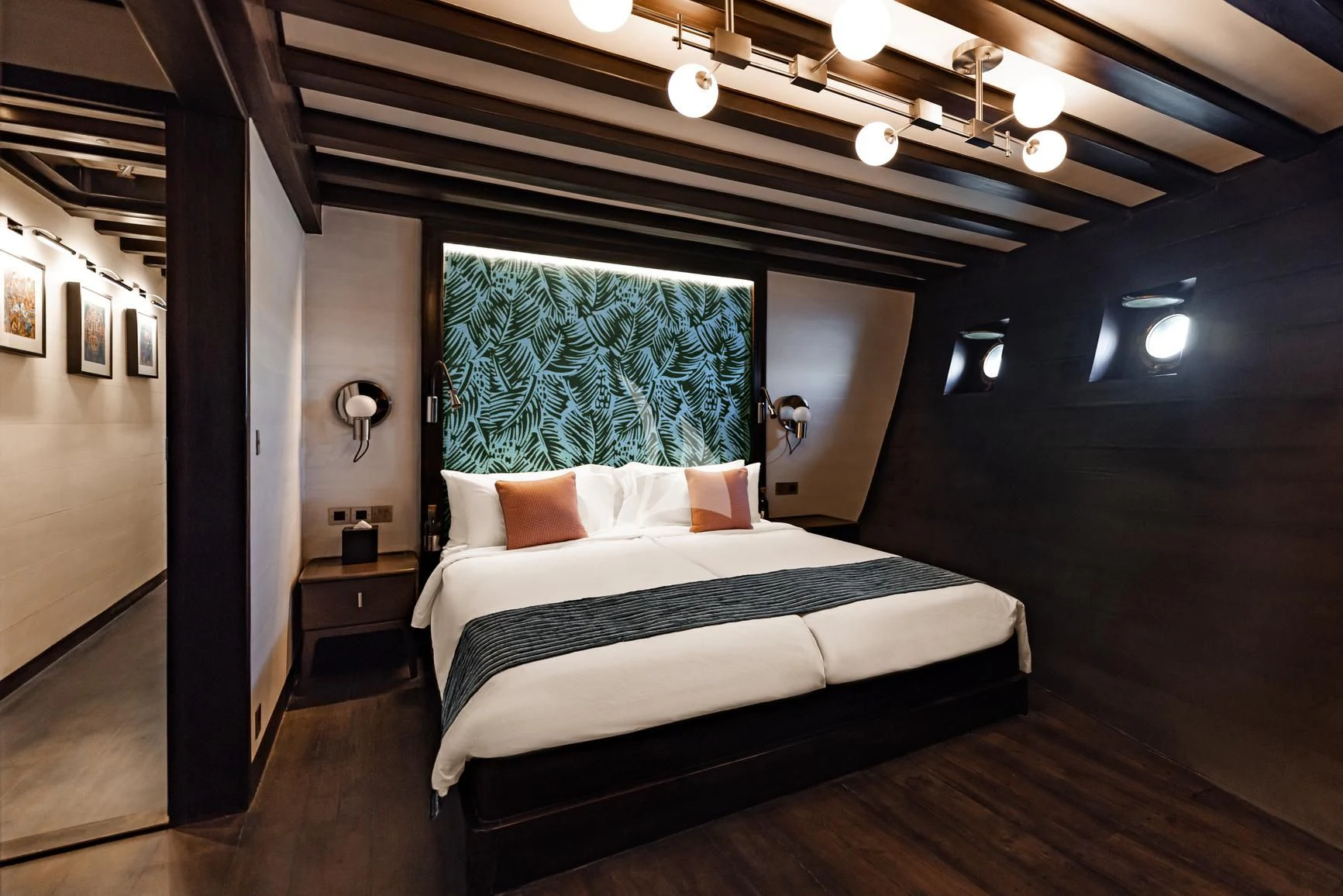 a bed in a room aboard VELA Yacht for Charter
