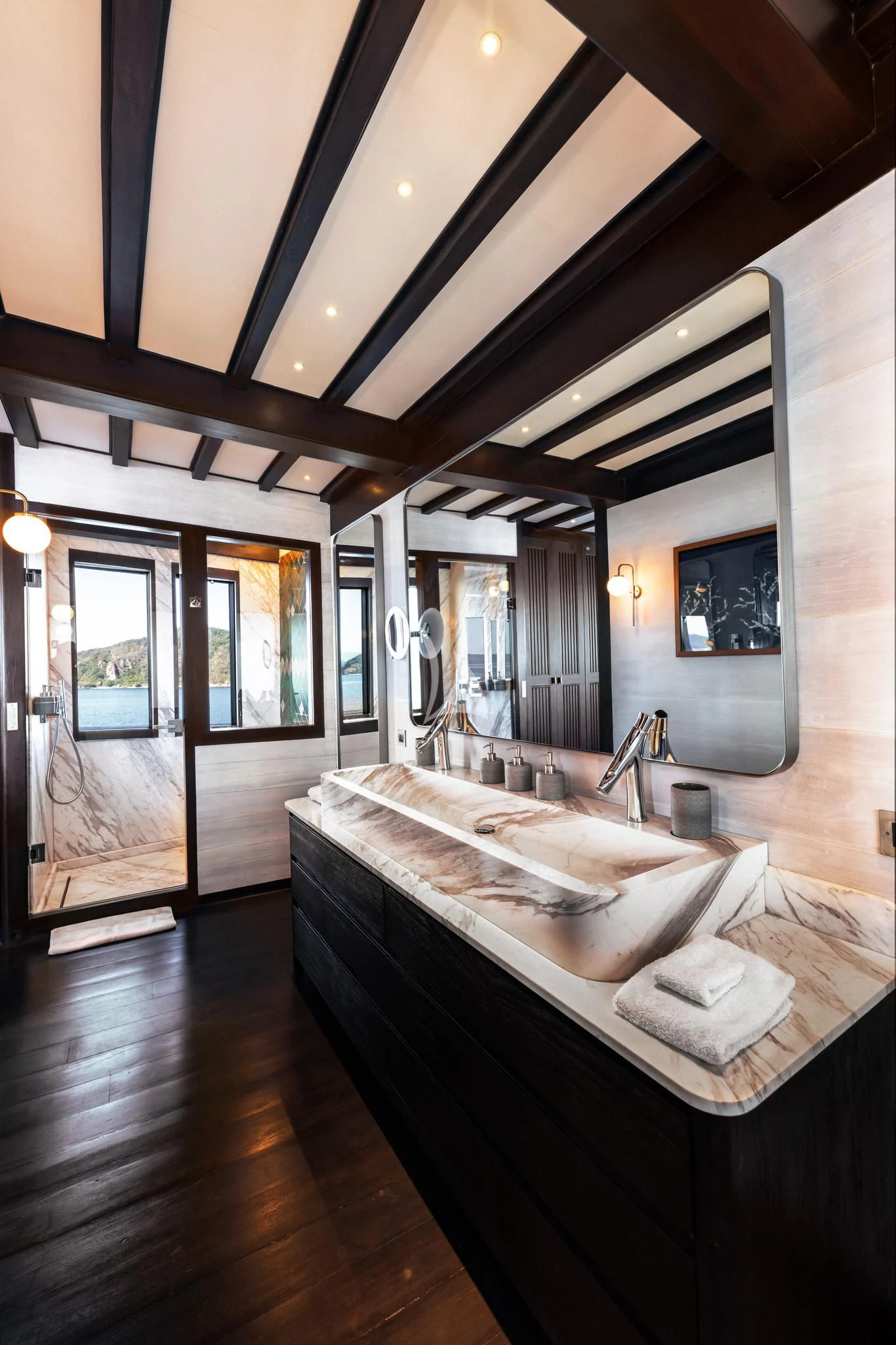 a large bathroom with a large bathtub aboard VELA Yacht for Charter