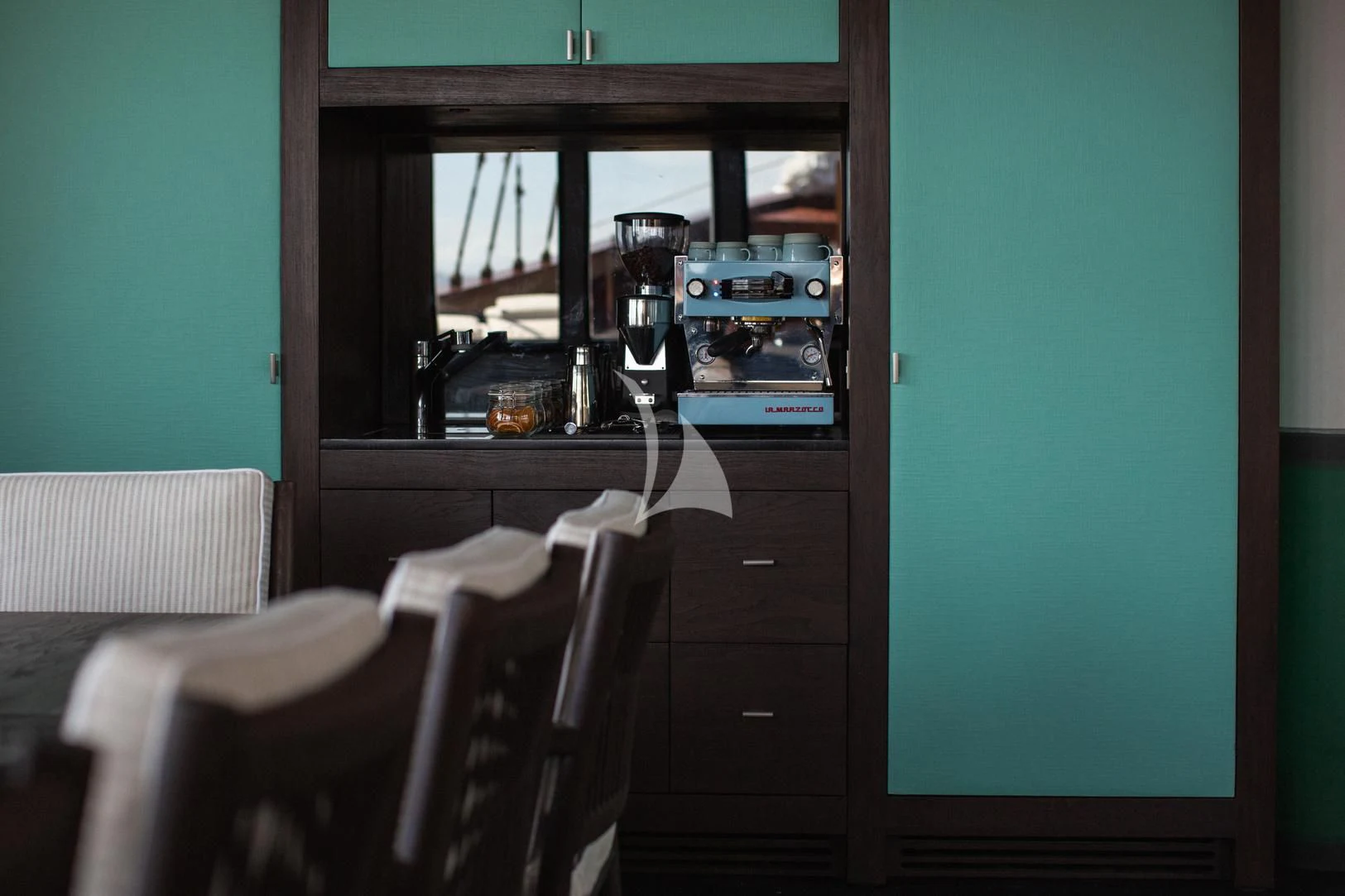 a kitchen with a table and chairs aboard VELA Yacht for Charter