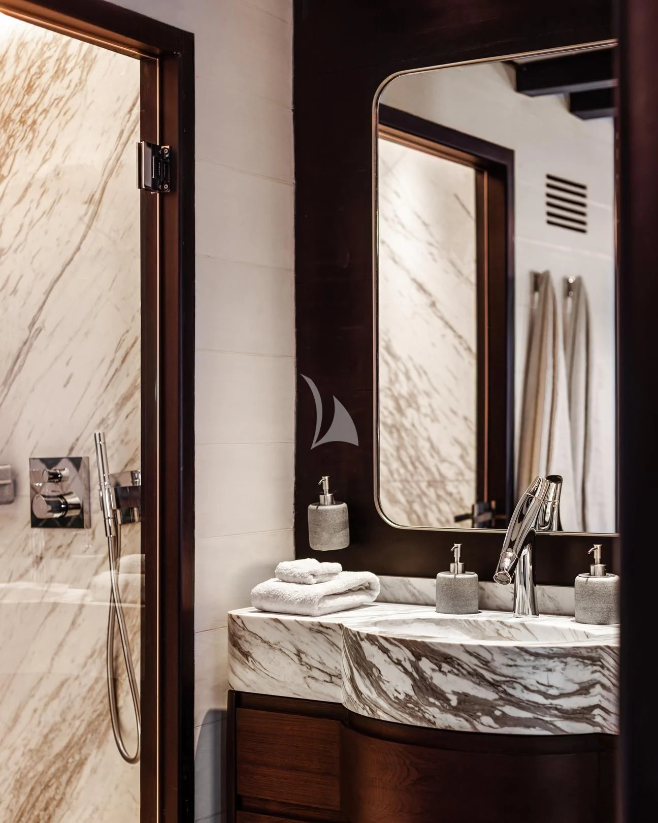 a bathroom with a large mirror aboard VELA Yacht for Charter