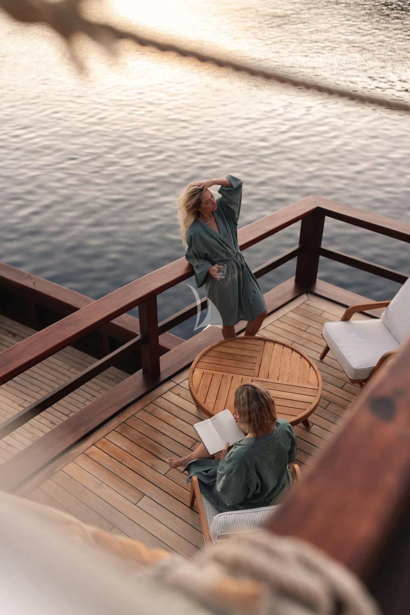 a person standing on a dock aboard VELA Yacht for Charter