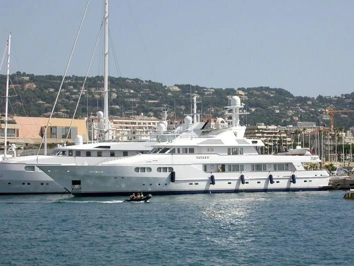 a large white boat in the water aboard TATASU Yacht for Sale