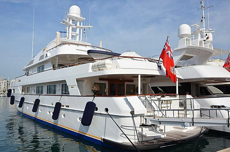 a boat with a flag on the front aboard TATASU Yacht for Sale
