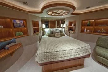 a large bedroom with a large bed aboard LADY GRACE Yacht for Sale