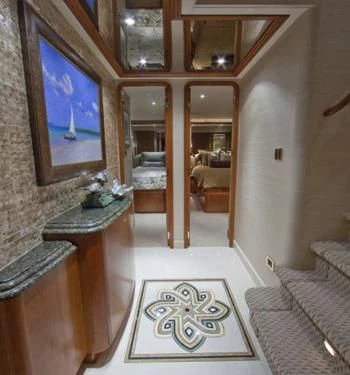a room with a mirror and a rug aboard LADY GRACE Yacht for Sale