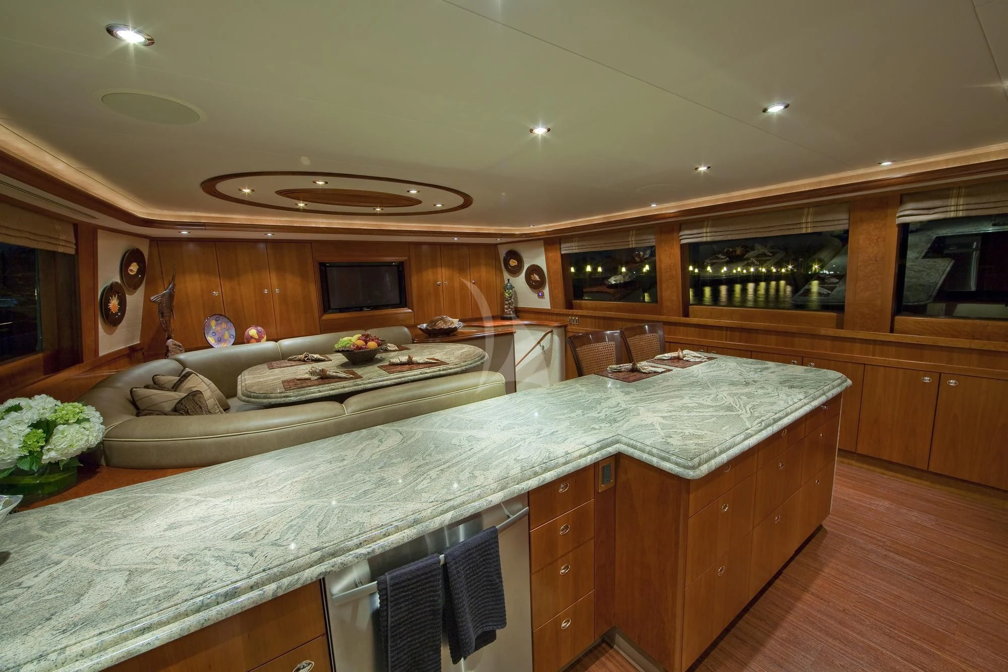 a large kitchen with wooden cabinets aboard LADY GRACE Yacht for Sale