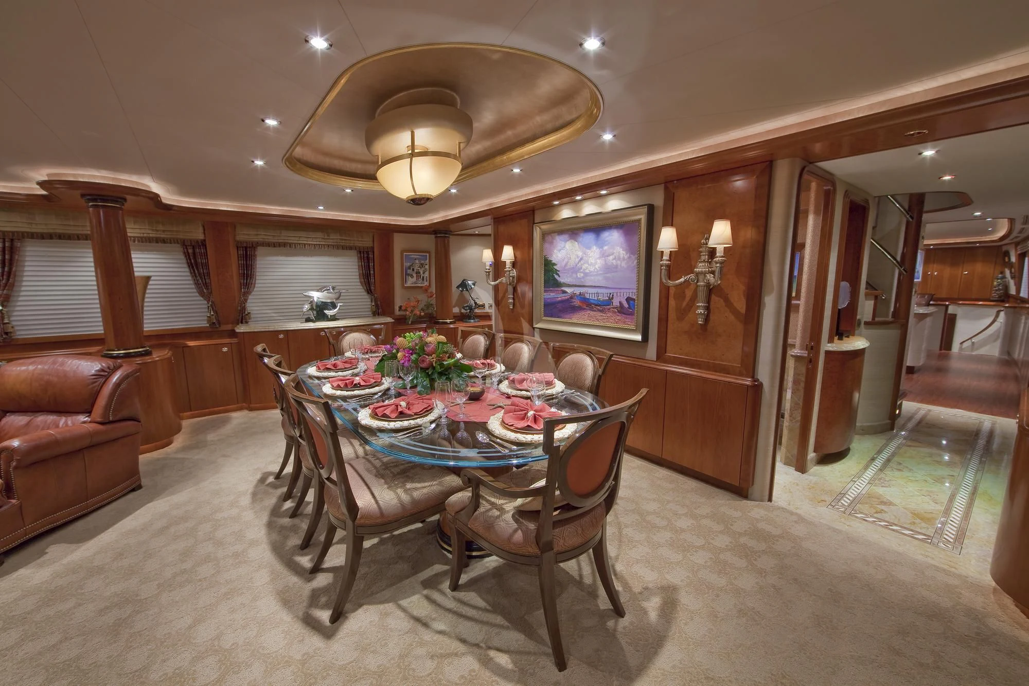 a dining room with a table and chairs aboard LADY GRACE Yacht for Sale