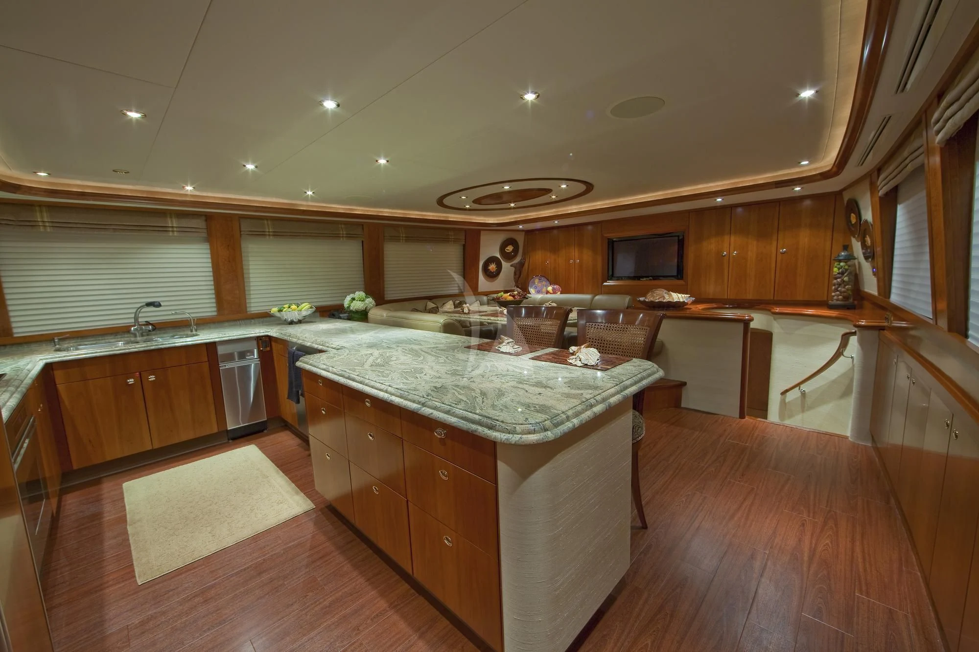 a large kitchen with wooden cabinets aboard LADY GRACE Yacht for Sale
