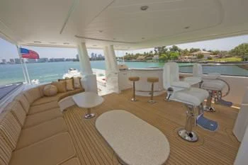 a large living room with a large pool and a deck aboard LADY GRACE Yacht for Sale