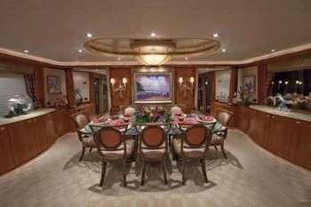a dining room with a table and chairs aboard LADY GRACE Yacht for Sale