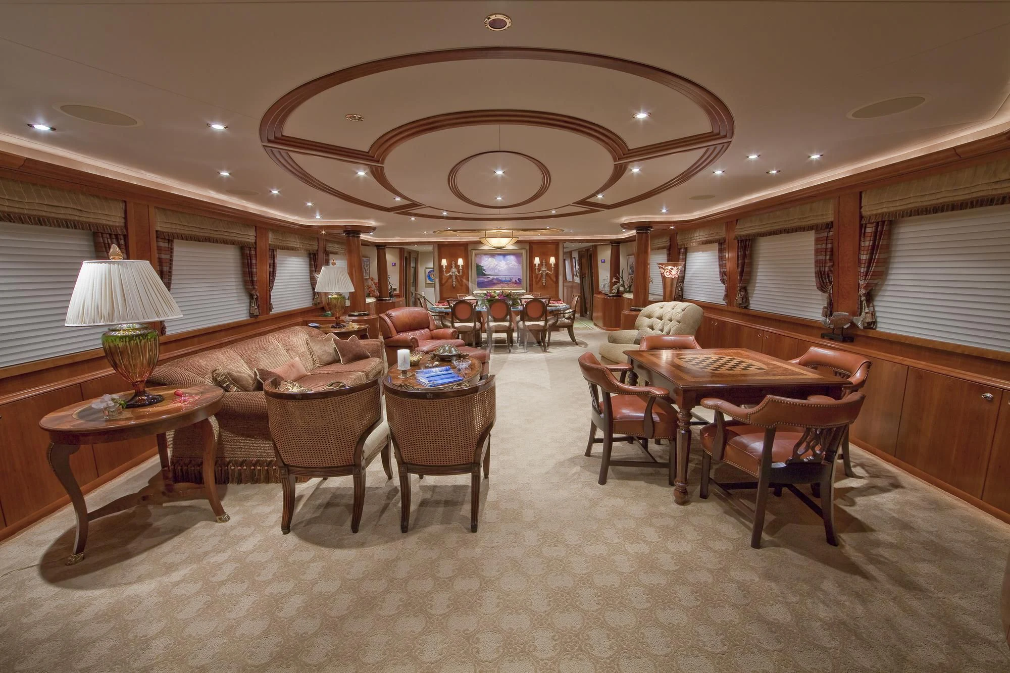 a large living room with a large chandelier aboard LADY GRACE Yacht for Sale