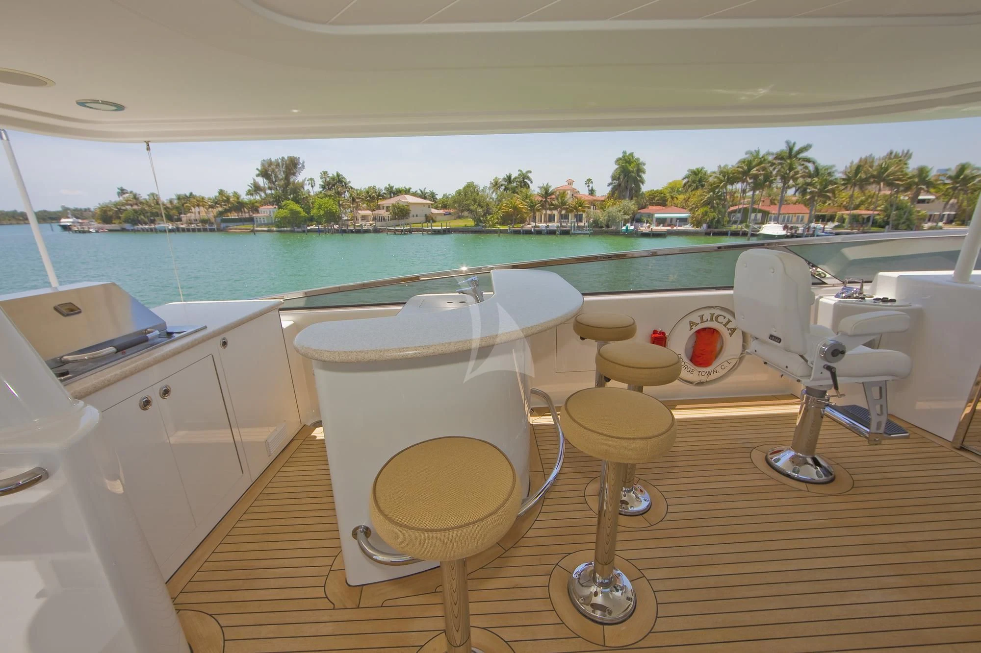 a room with a table chairs and a pool aboard LADY GRACE Yacht for Sale