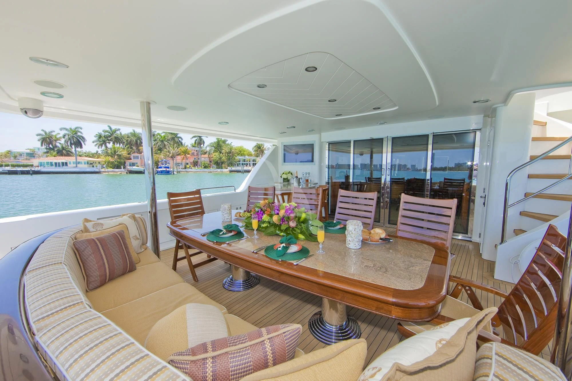 a living room with a table and chairs aboard LADY GRACE Yacht for Sale