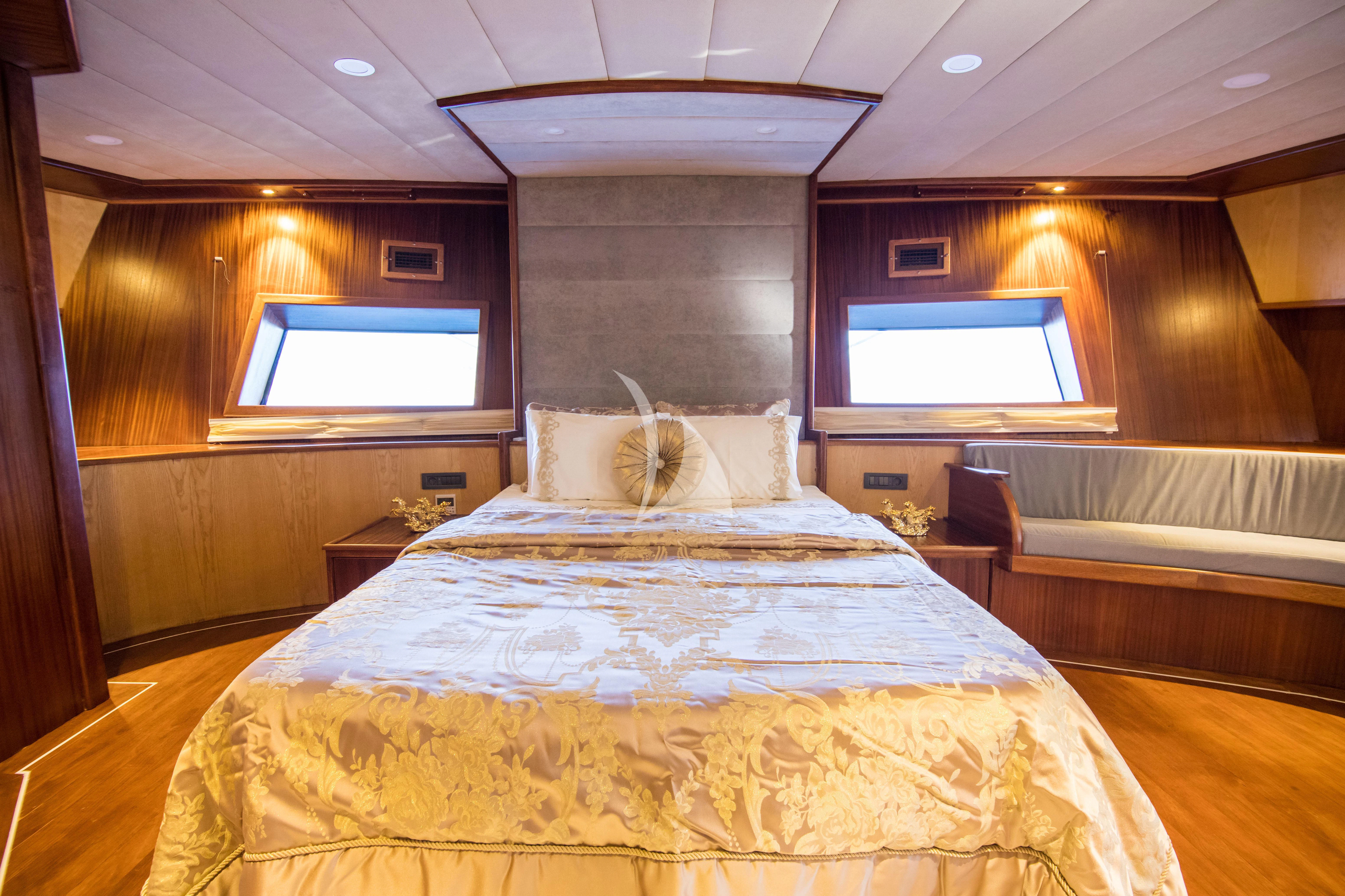 a room with a bed and a television aboard NEVRA QUEEN Yacht for Sale