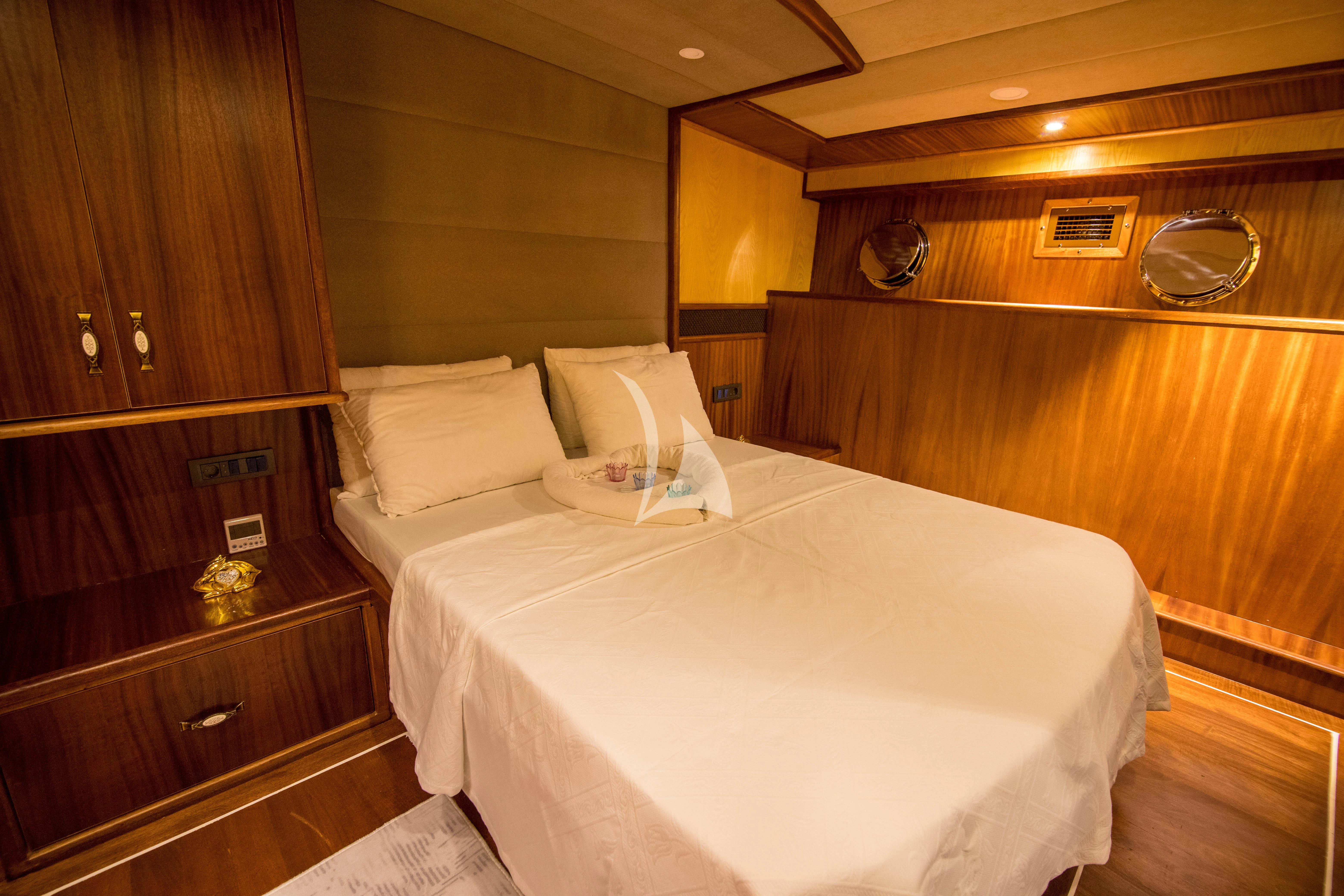 a bed in a room aboard NEVRA QUEEN Yacht for Sale