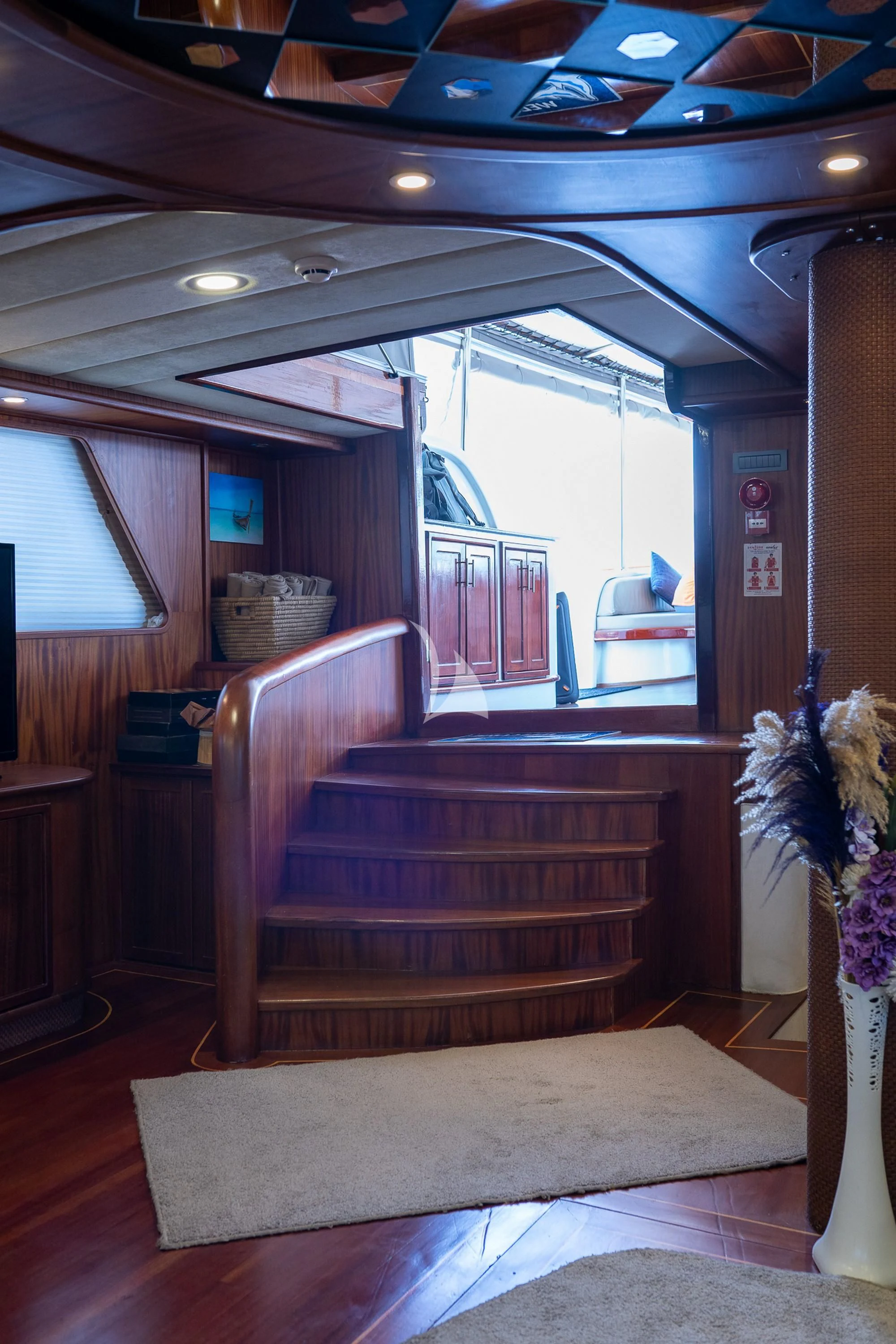 a room with a bench and a table aboard NEVRA QUEEN Yacht for Sale