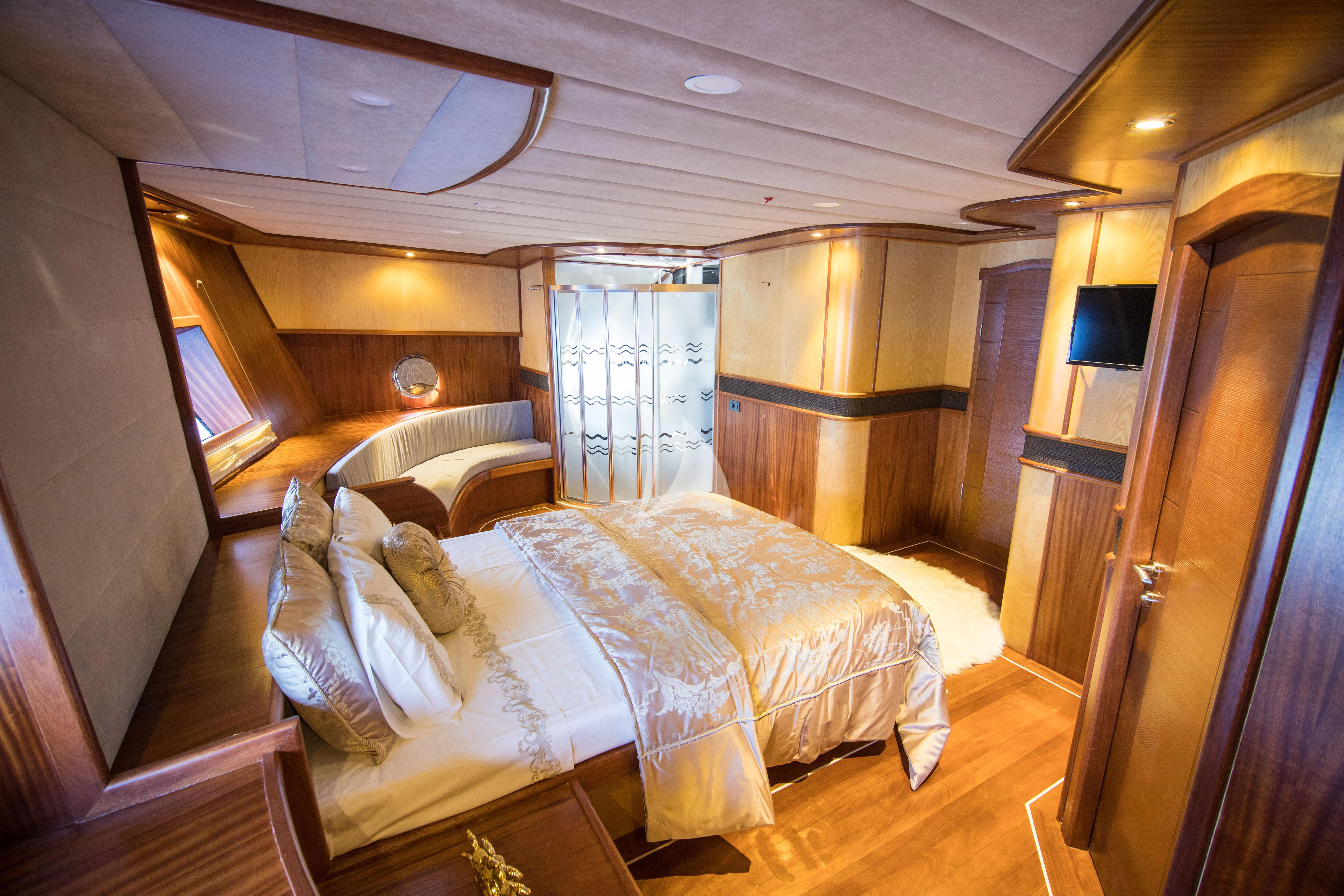 a room with a bed and a television aboard NEVRA QUEEN Yacht for Sale