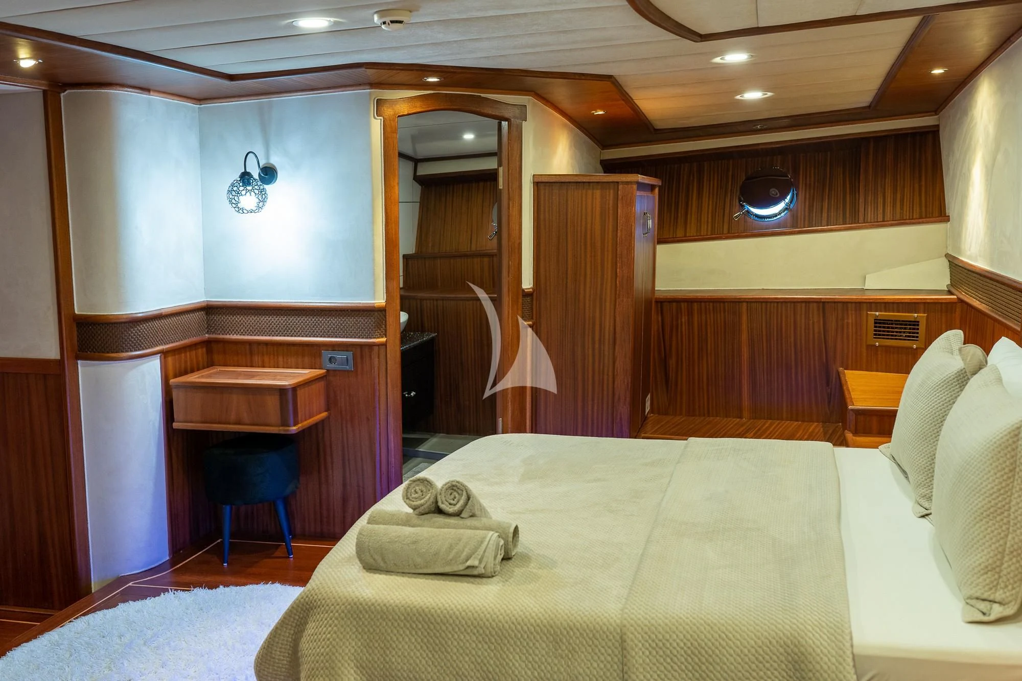 a room with a bed and a desk aboard NEVRA QUEEN Yacht for Sale