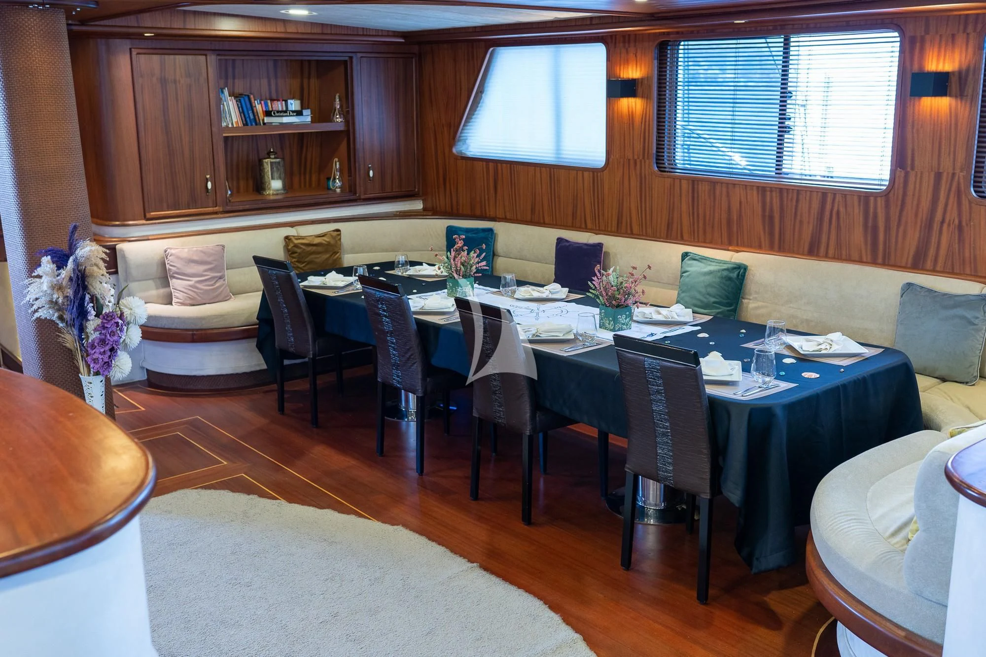 a dining room with a couch and a table aboard NEVRA QUEEN Yacht for Sale