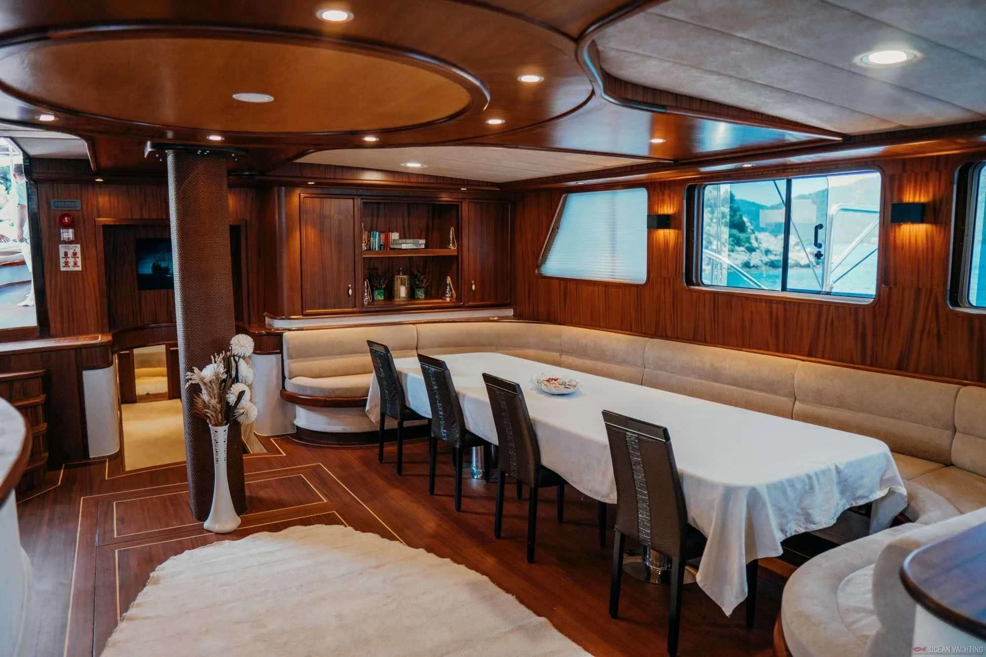 a room with tables and chairs aboard NEVRA QUEEN Yacht for Sale