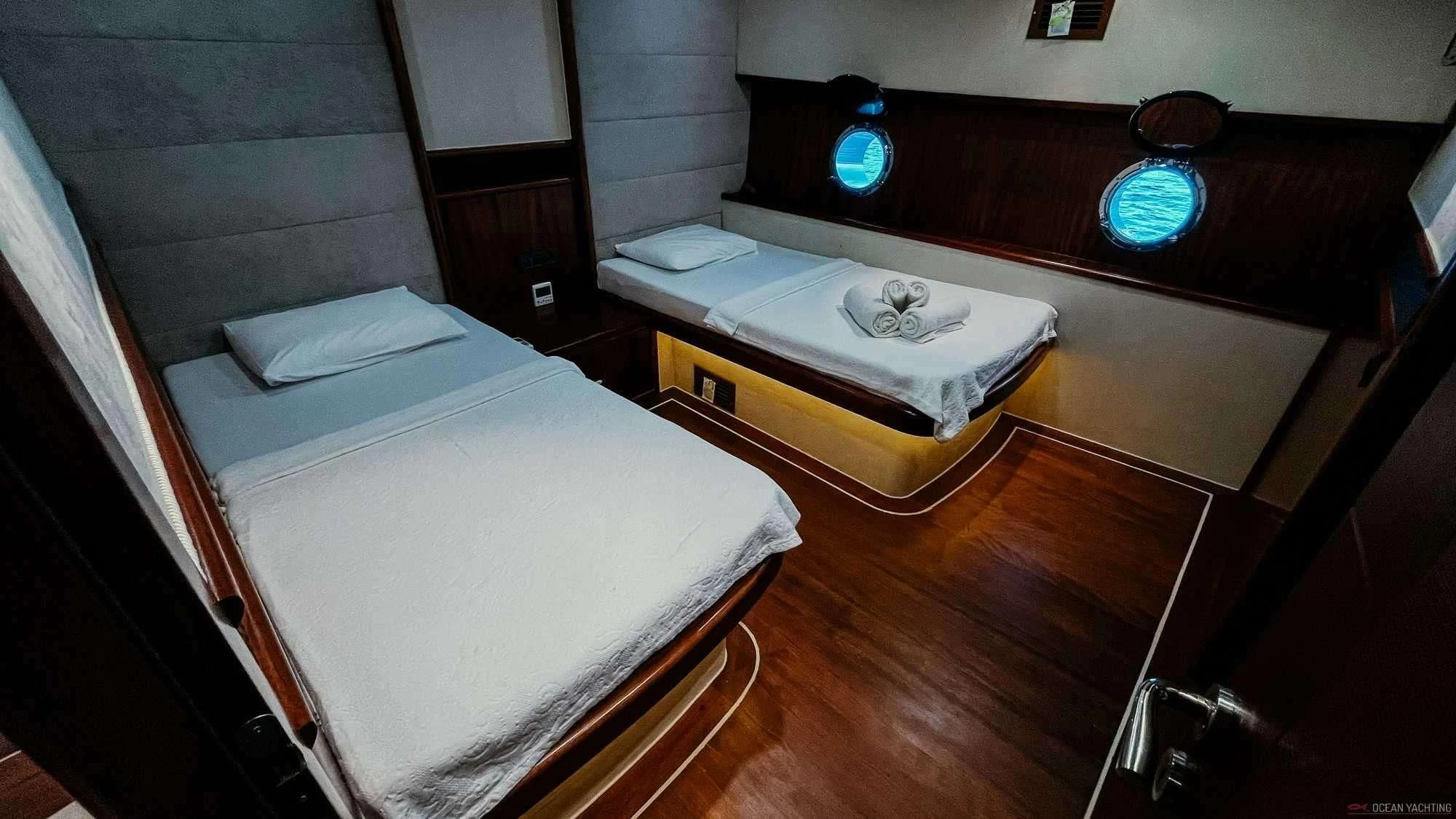 a room with a bed and a window aboard NEVRA QUEEN Yacht for Sale