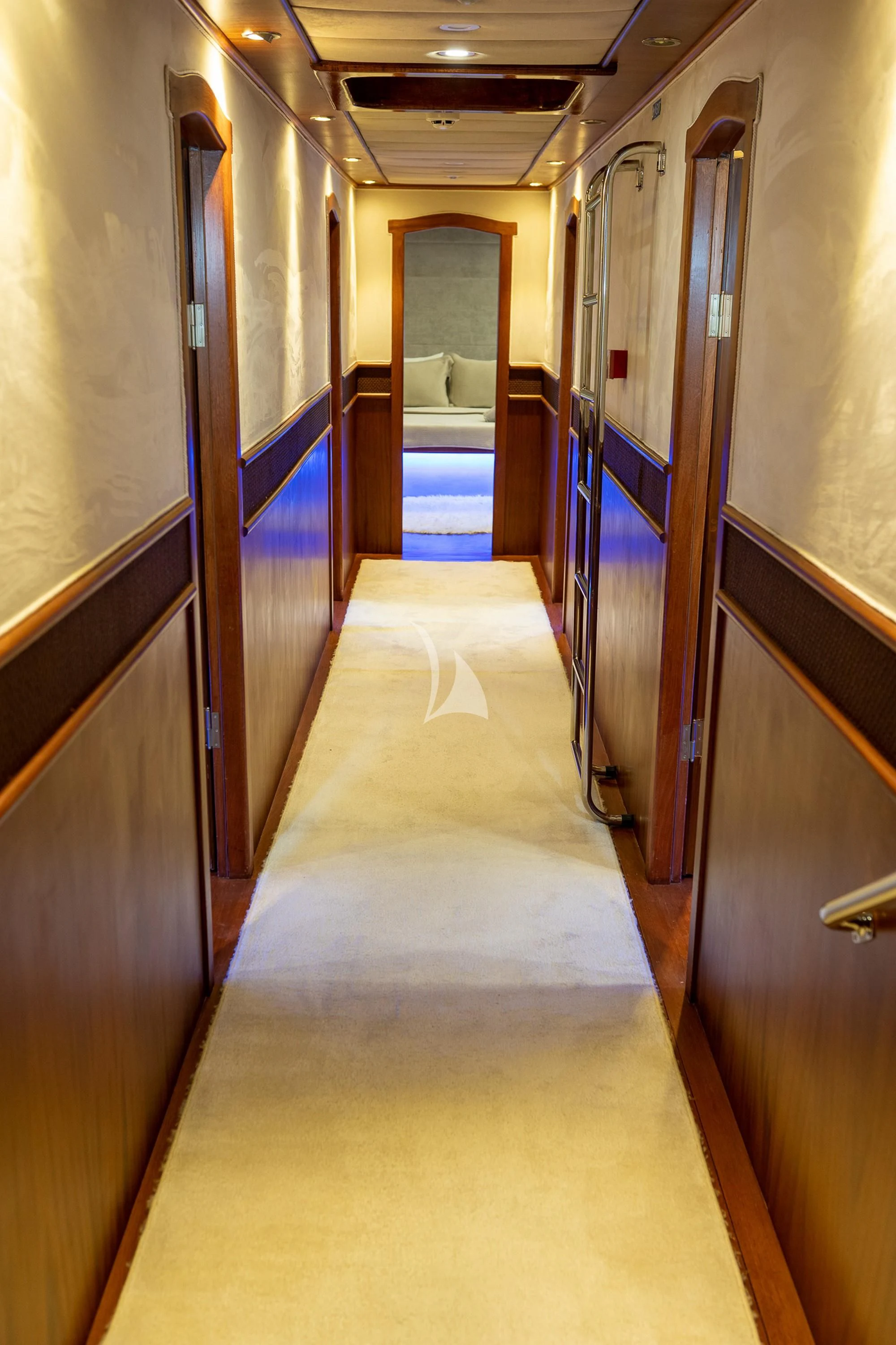 a hallway with a door and a chair aboard NEVRA QUEEN Yacht for Sale