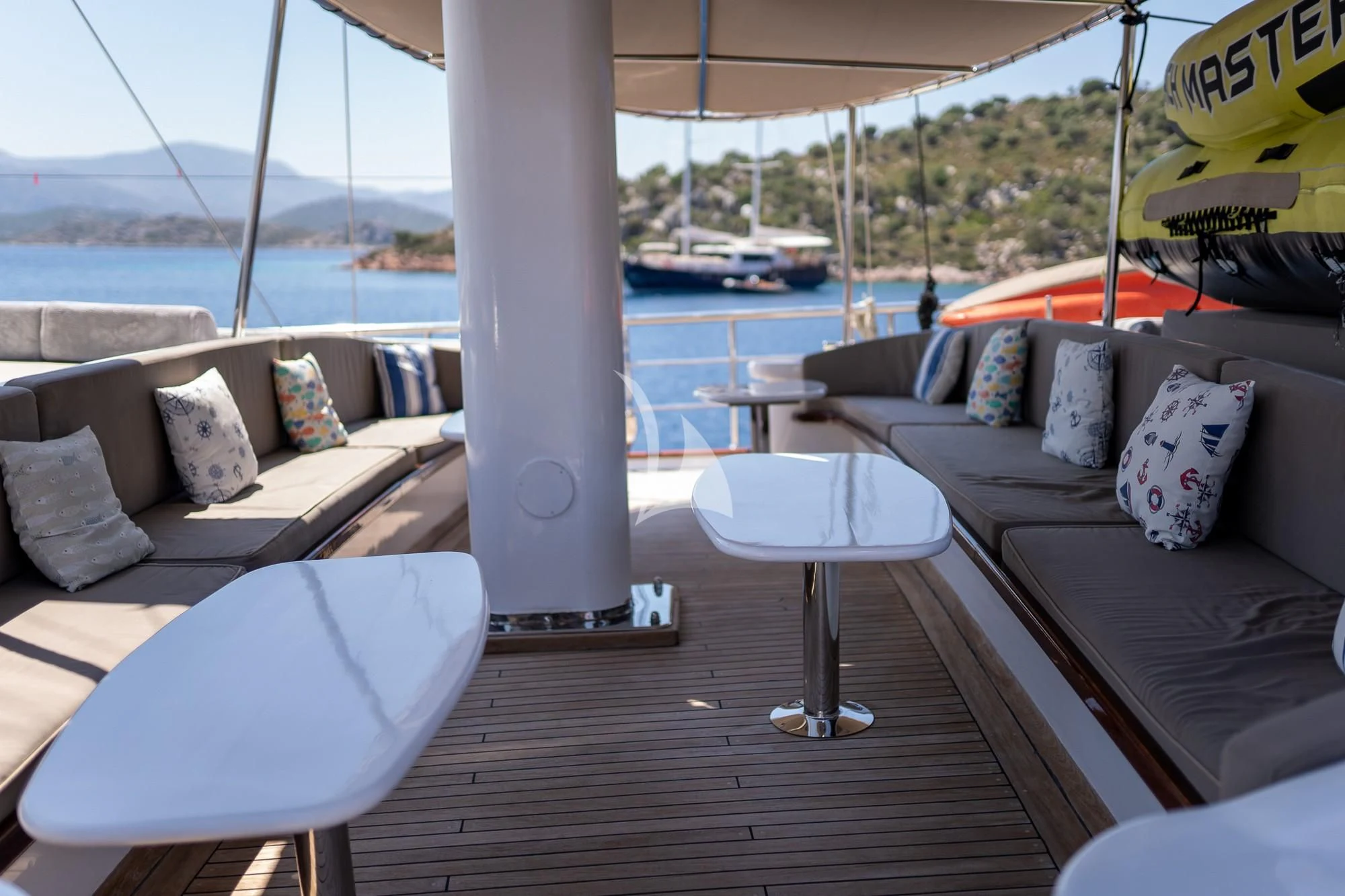 a table with pillows on it aboard NEVRA QUEEN Yacht for Sale