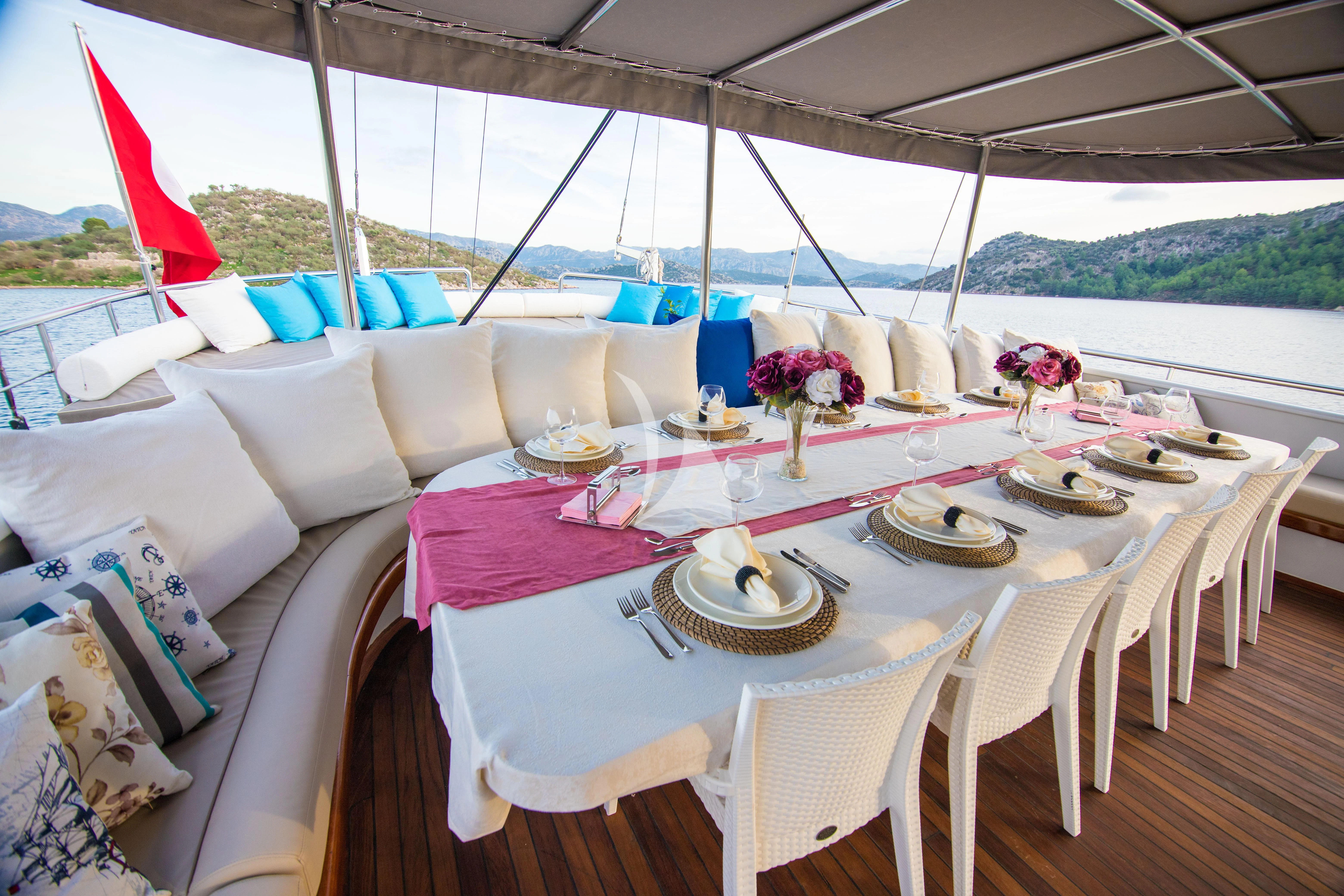 a table set for a dinner aboard NEVRA QUEEN Yacht for Sale