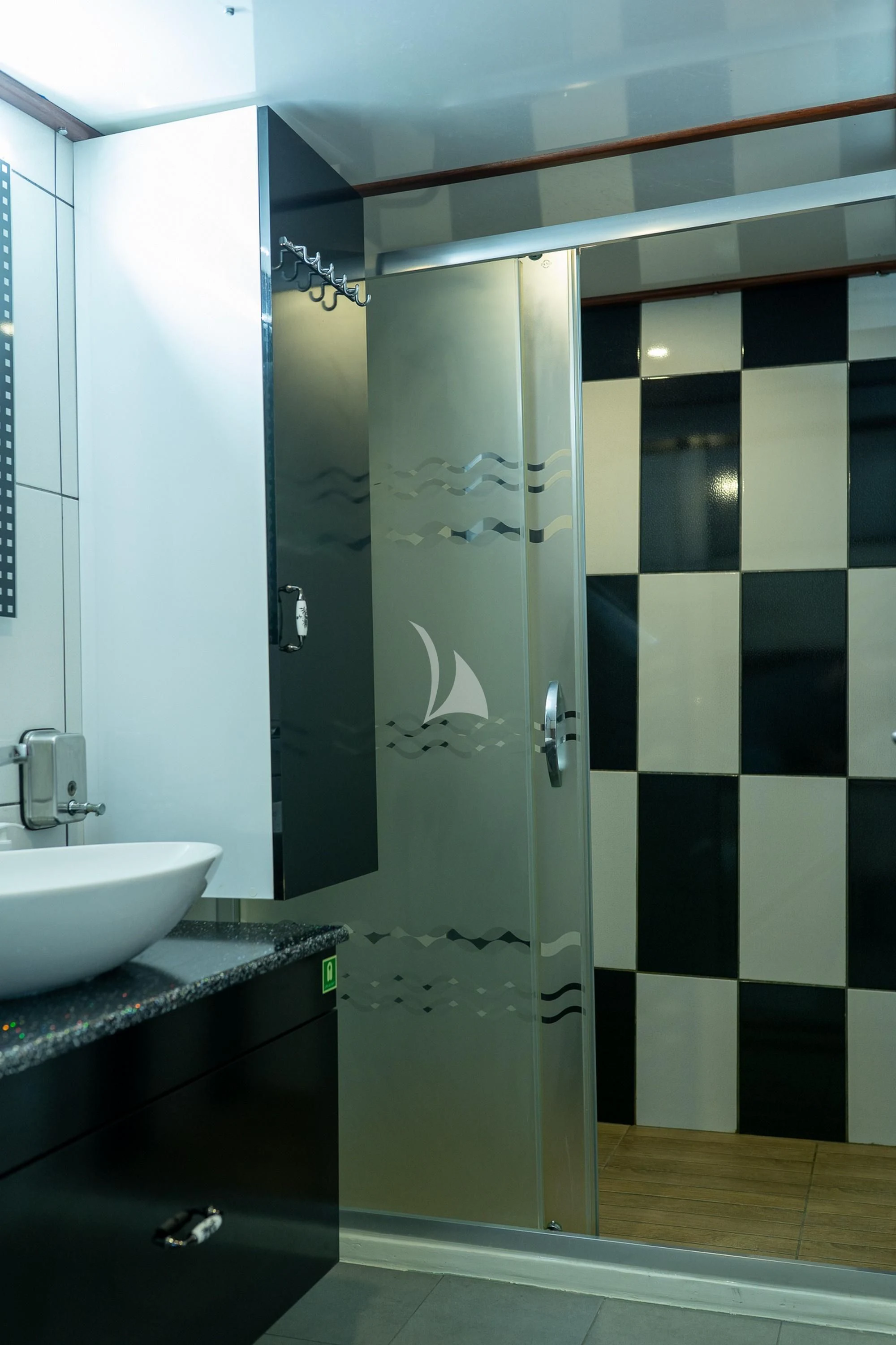 a bathroom with a sink and a shower aboard NEVRA QUEEN Yacht for Sale