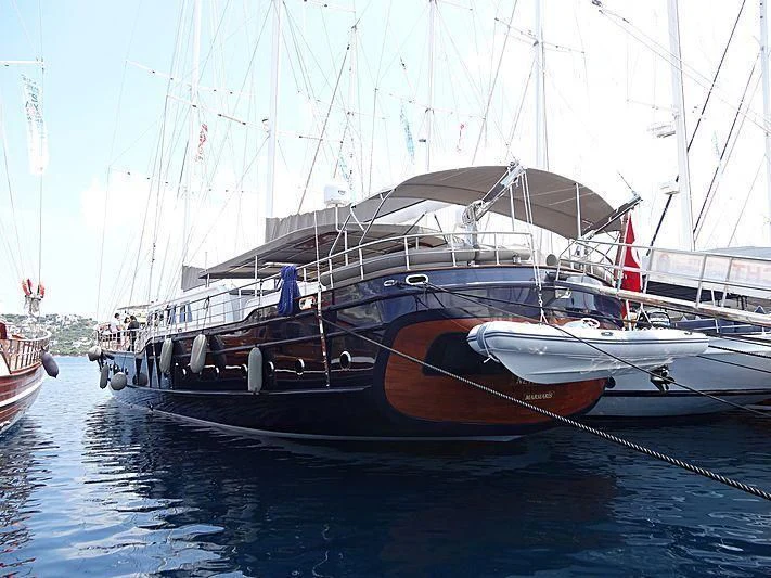 a boat docked at a pier aboard NEVRA QUEEN Yacht for Sale