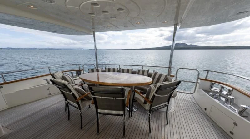 a table and chairs on a boat aboard INTEGRITY Yacht for Sale