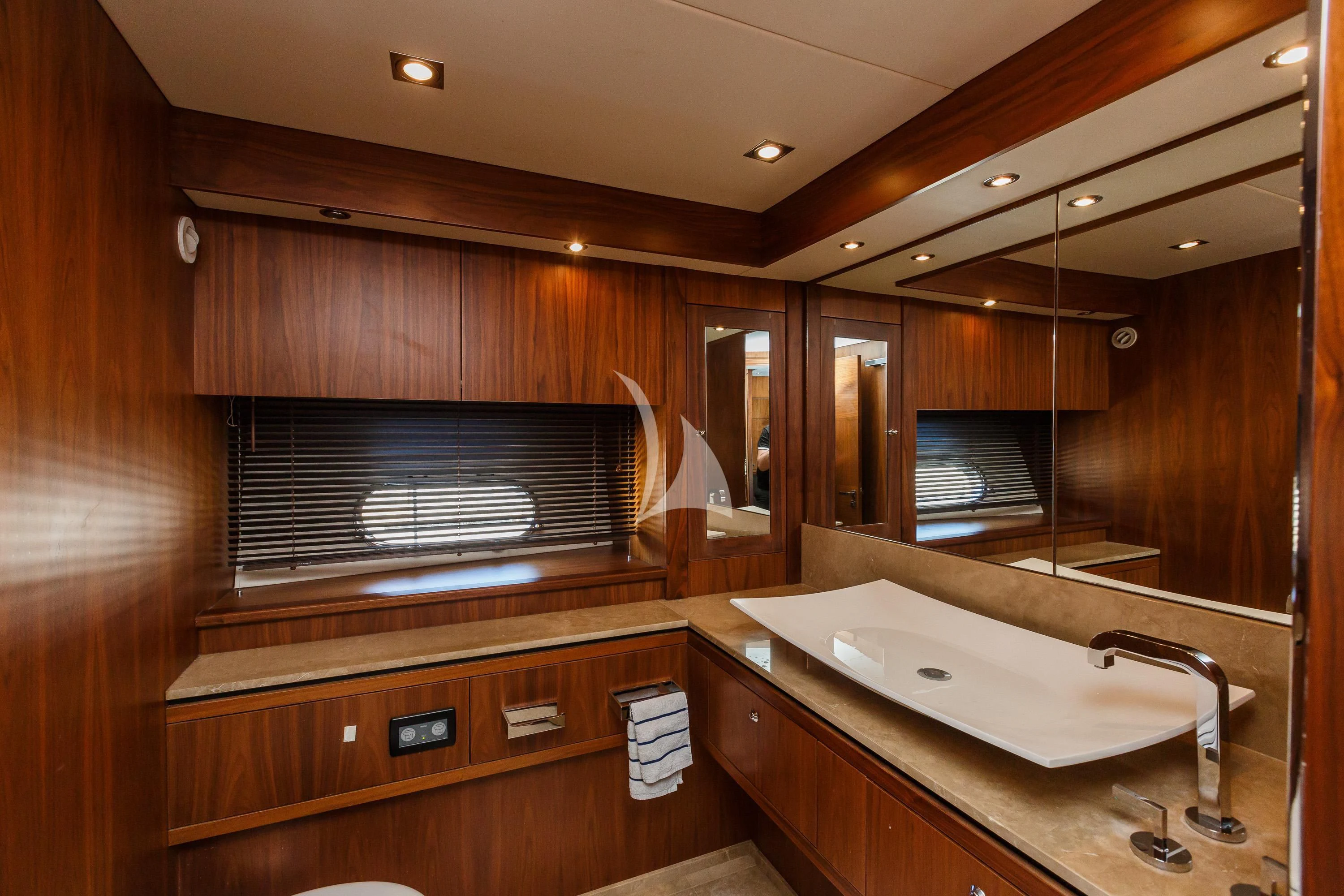 a bathroom with a sink and a large mirror aboard THE BEST WAY Yacht for Sale