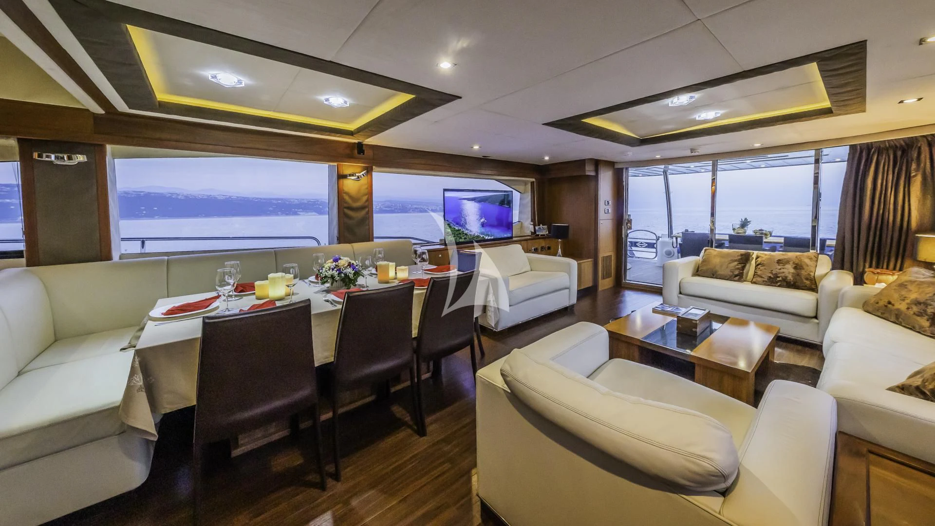 a large room with a table and chairs aboard THE BEST WAY Yacht for Sale