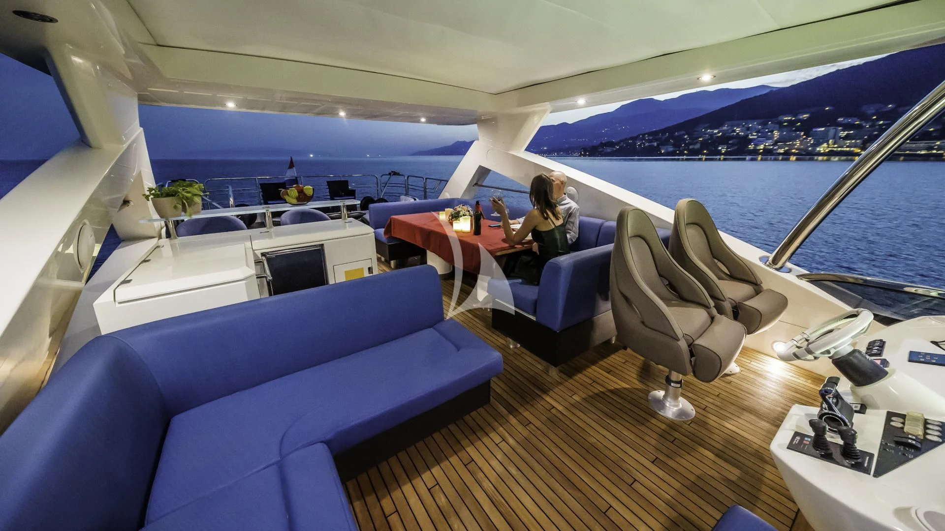 a boat with a view of the ocean and a few people sitting on it aboard THE BEST WAY Yacht for Sale