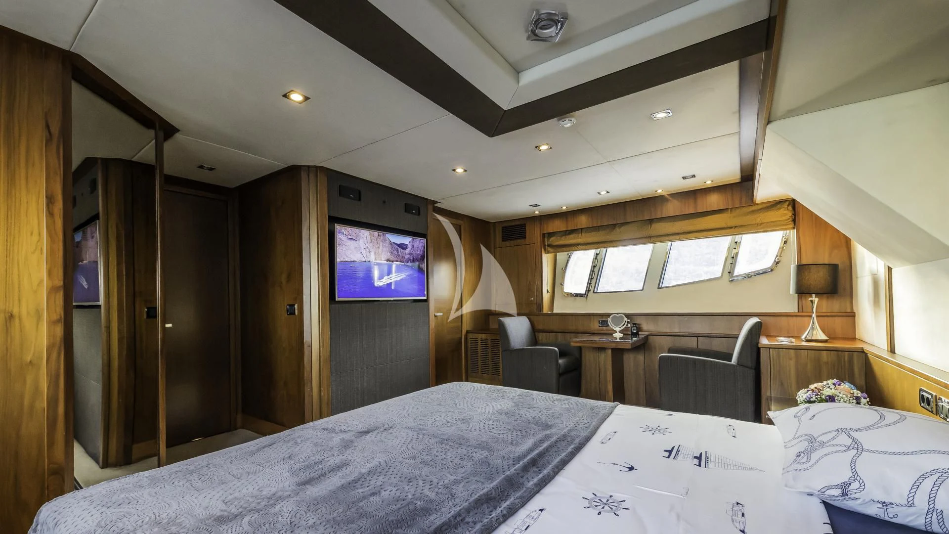a room with a bed and a television aboard THE BEST WAY Yacht for Sale