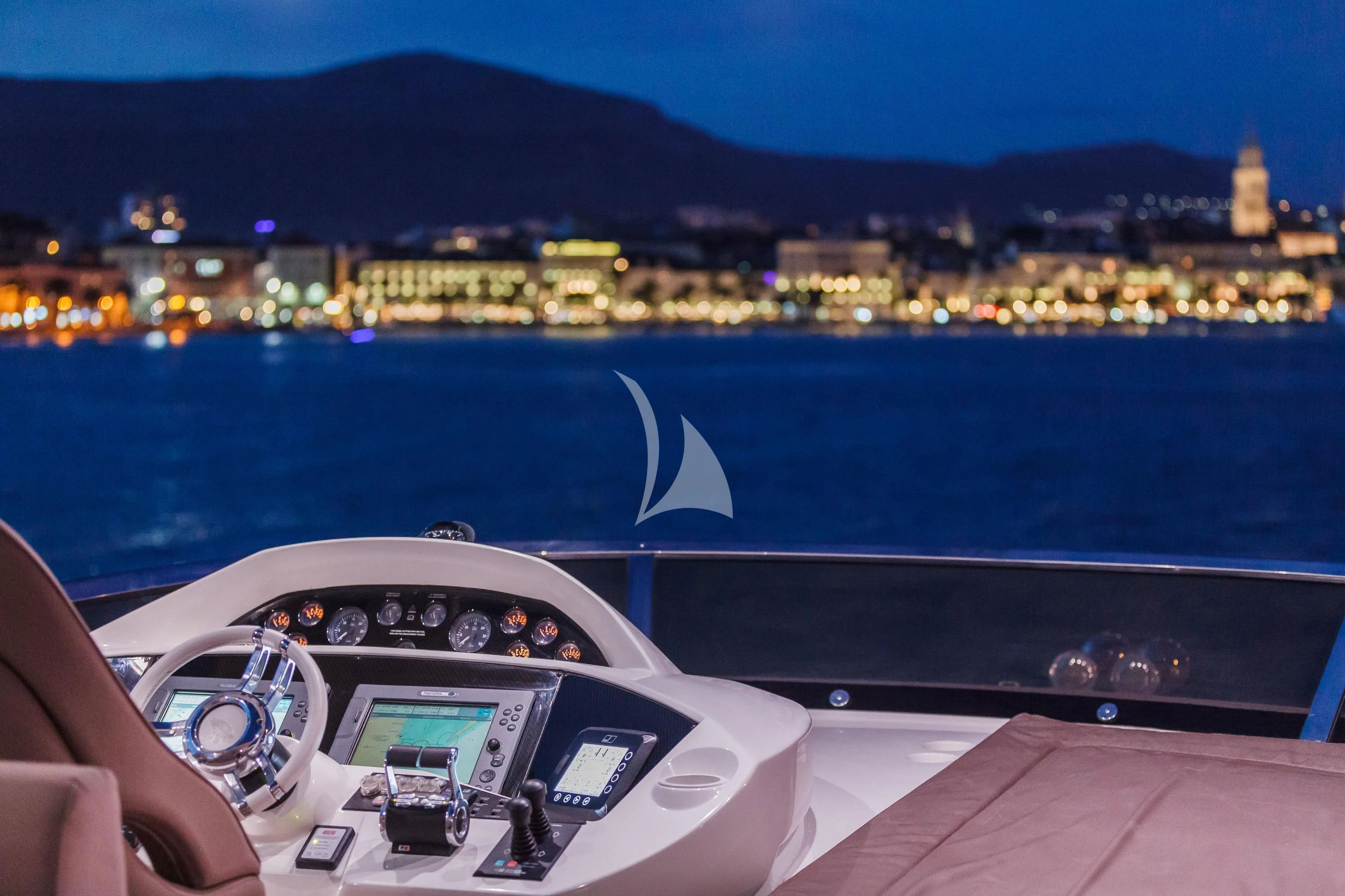a person driving a car on a road by a body of water aboard THE BEST WAY Yacht for Sale