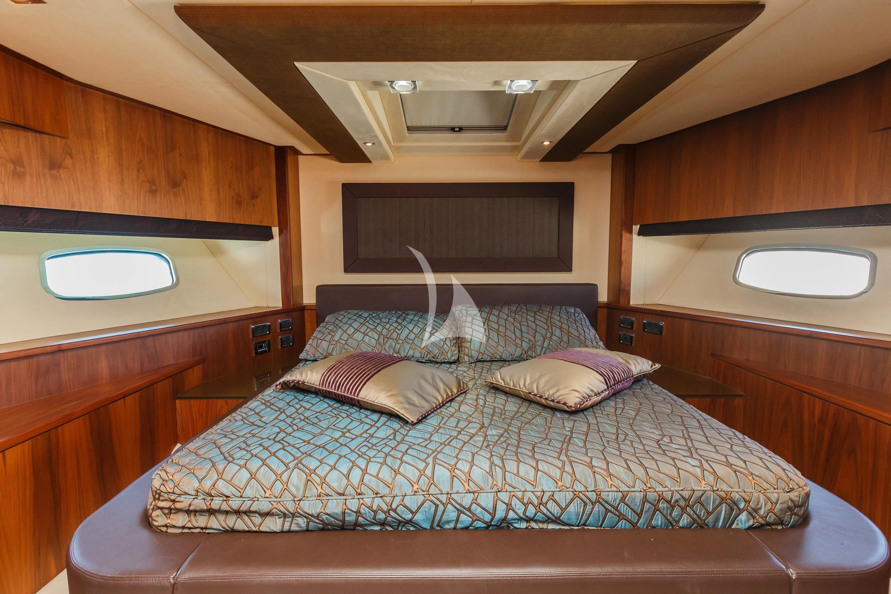 a bed with a purple blanket aboard THE BEST WAY Yacht for Sale