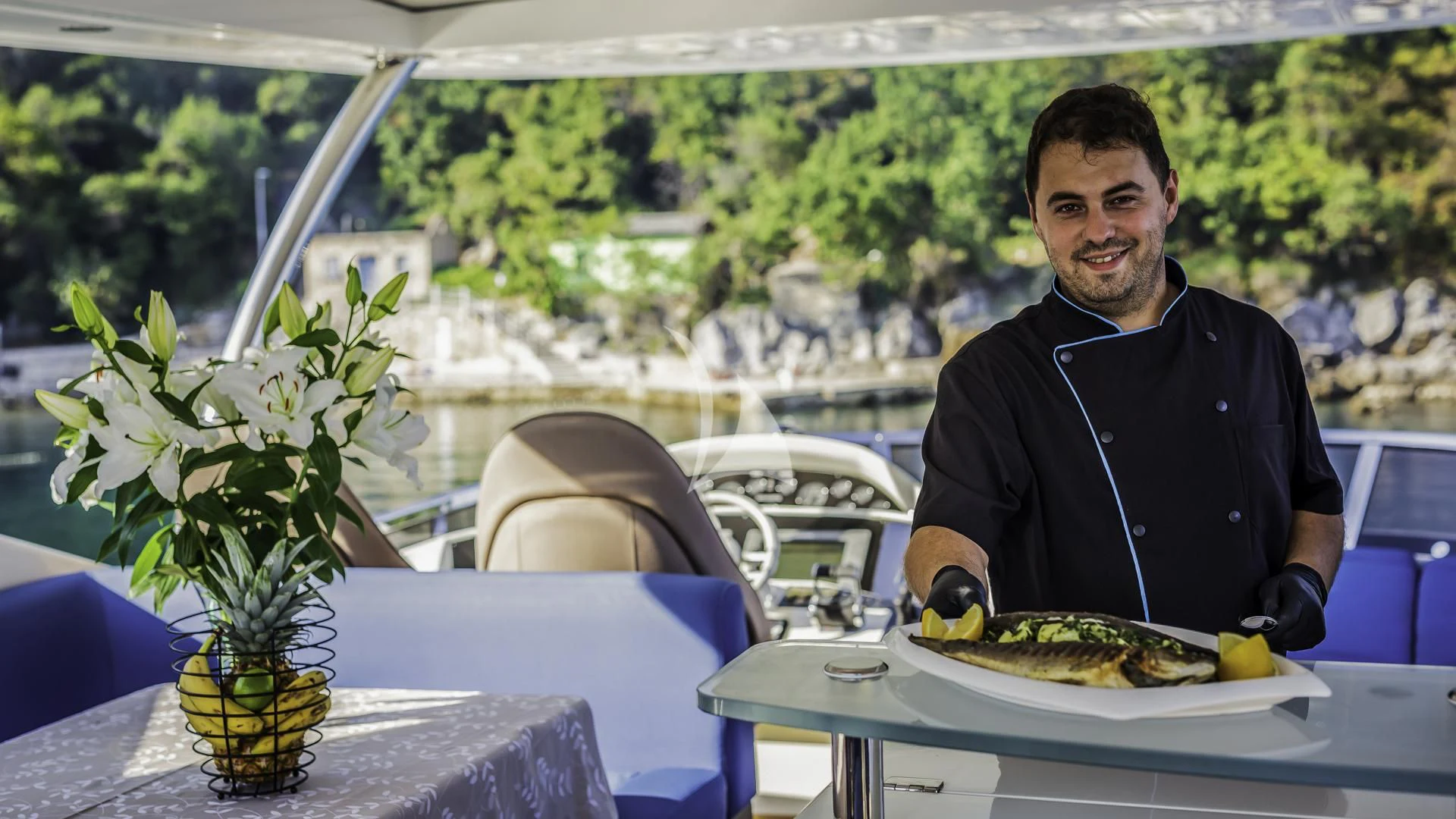 a person sitting at a table aboard THE BEST WAY Yacht for Sale