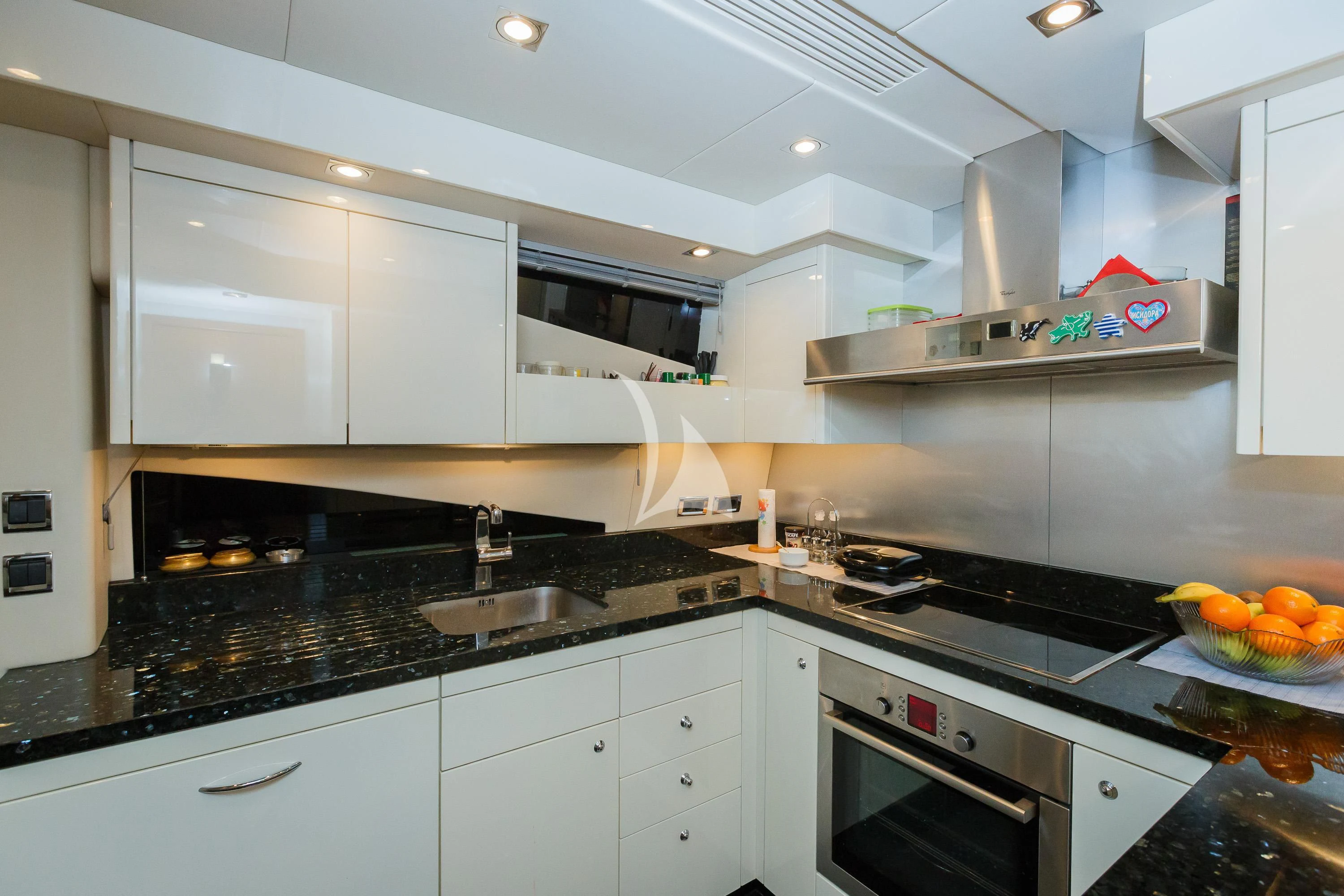 a kitchen with white cabinets aboard THE BEST WAY Yacht for Sale
