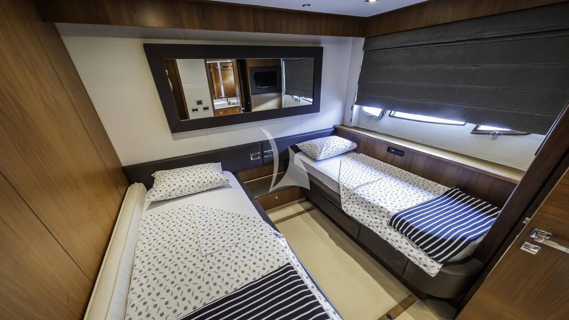 a room with a bed and a television on the wall aboard THE BEST WAY Yacht for Sale