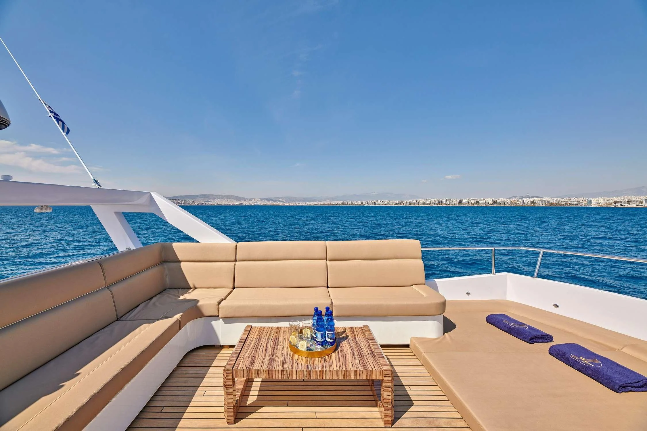 a deck with a beach and water aboard WIDE LIBERTY Yacht for Sale