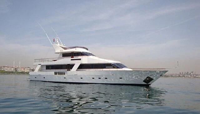 a white yacht in the water aboard WIDE LIBERTY Yacht for Sale