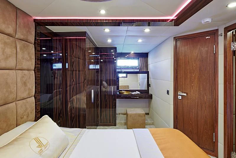 a room with a table and a door aboard WIDE LIBERTY Yacht for Sale