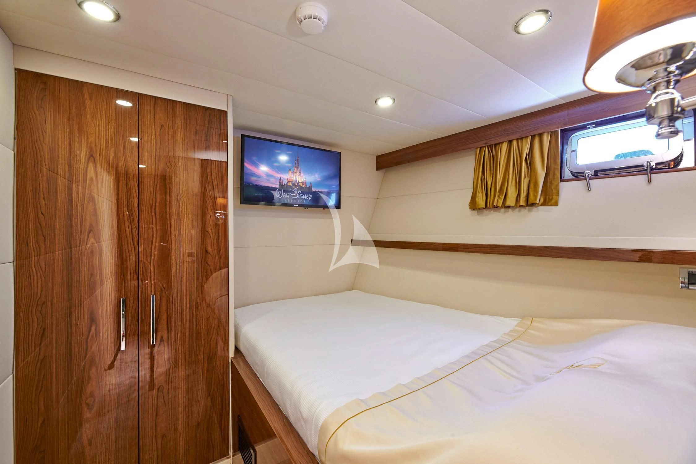 a room with a bed and a television aboard WIDE LIBERTY Yacht for Sale