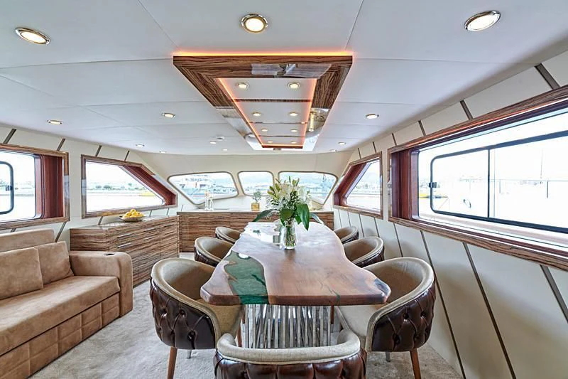 a train with a table and chairs aboard WIDE LIBERTY Yacht for Sale