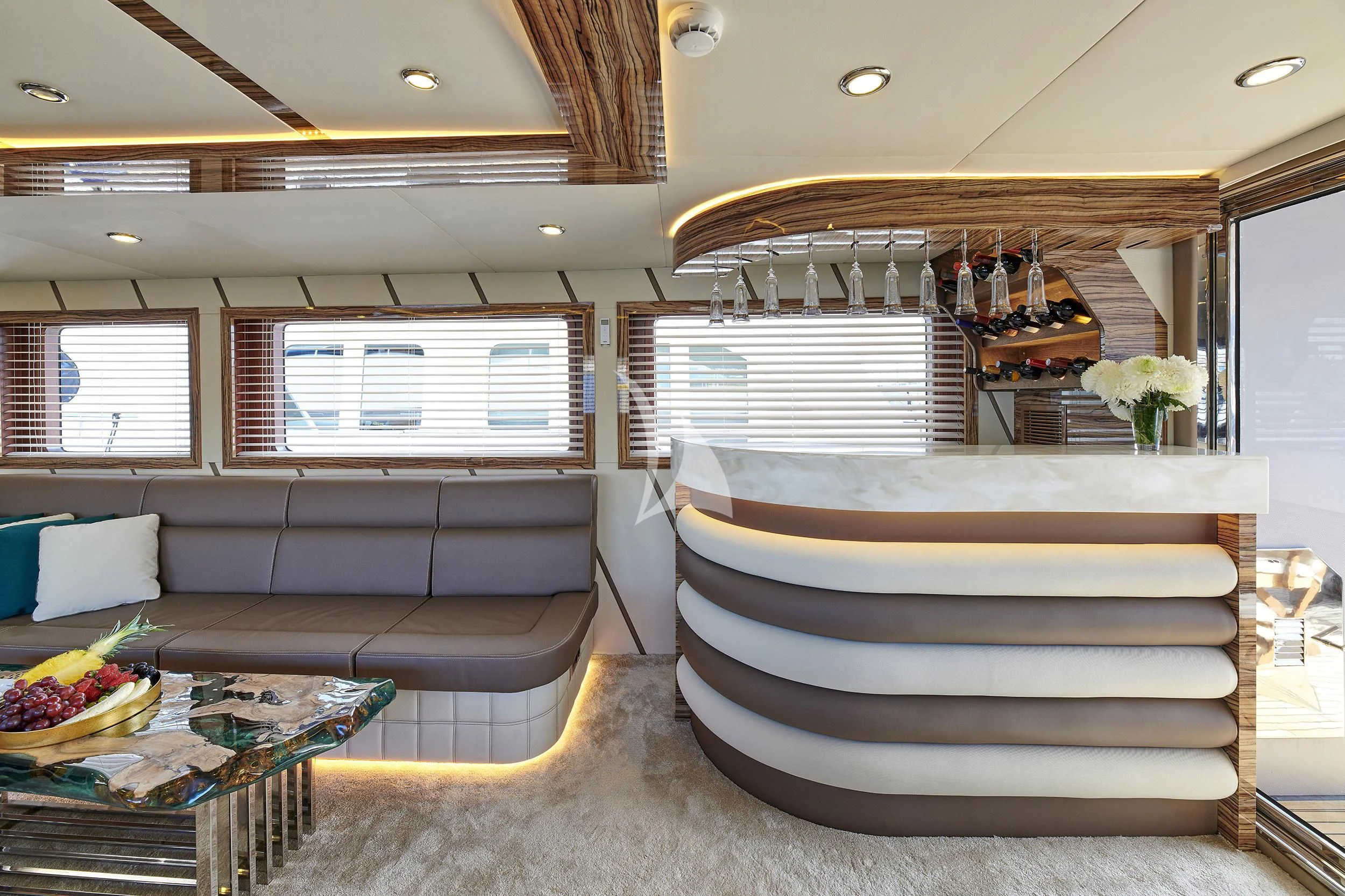 a room with couches and a table aboard WIDE LIBERTY Yacht for Sale