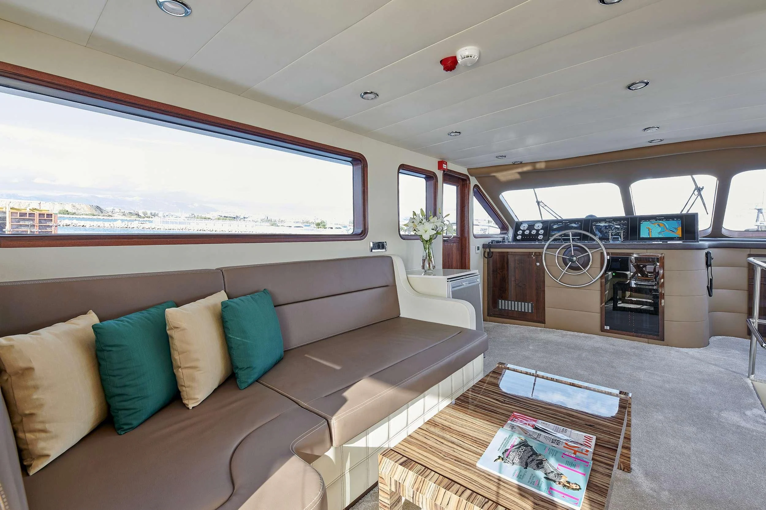 a living room with a couch and a tv aboard WIDE LIBERTY Yacht for Sale