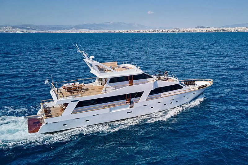 a white yacht in the water aboard WIDE LIBERTY Yacht for Sale
