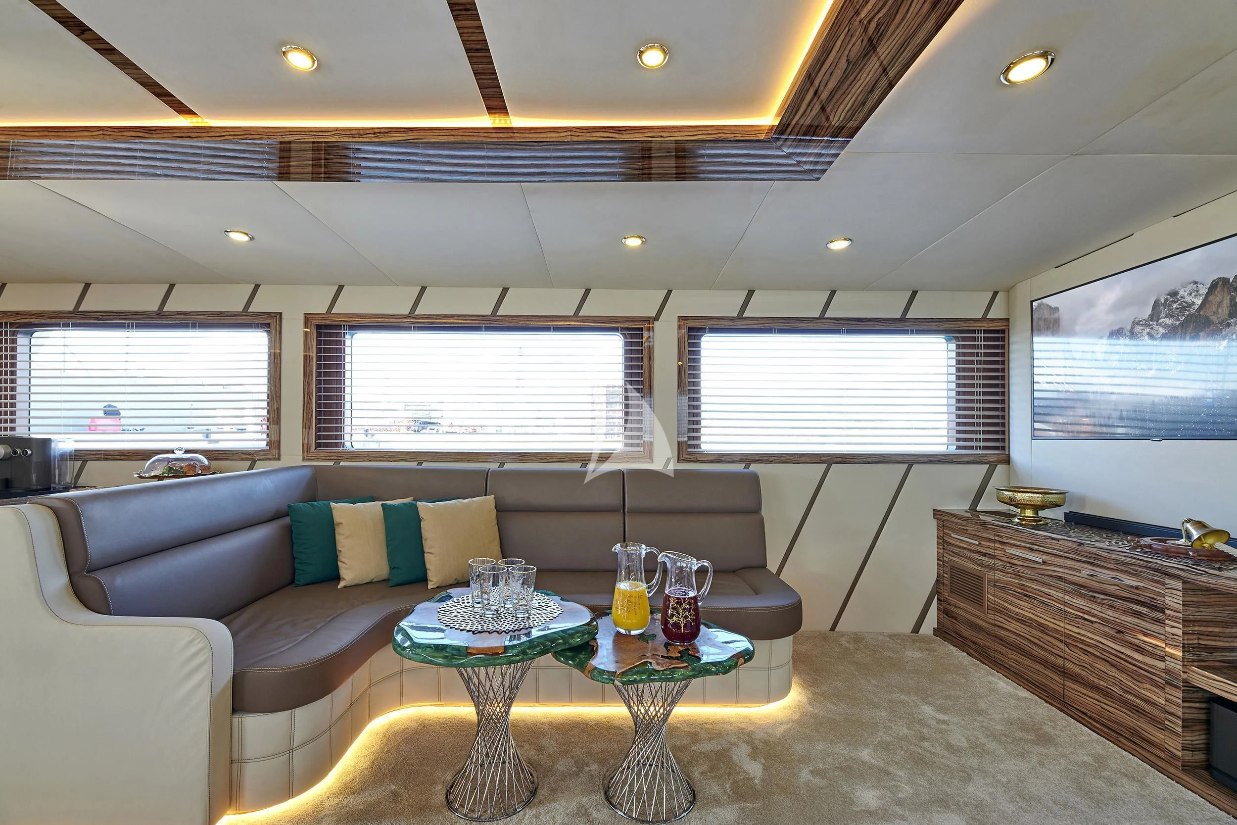 a living room with a couch and a table aboard WIDE LIBERTY Yacht for Sale